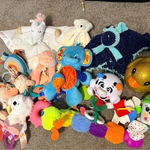 Lot of baby toys and loveys